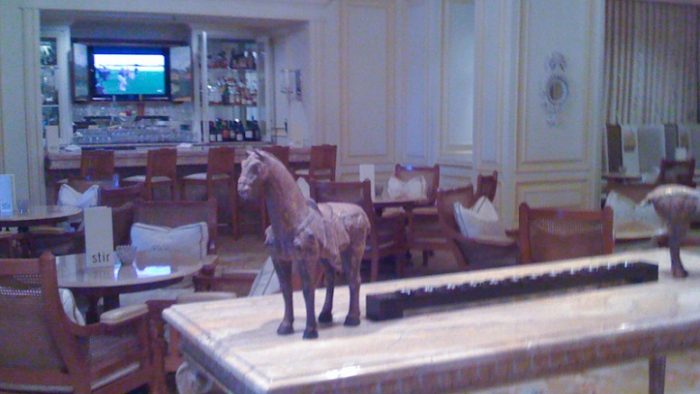 Horse wooden statue adoring the bar