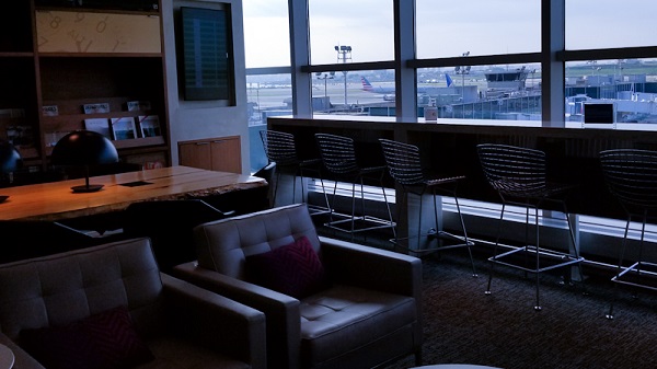 Library with sofas and stool chairs overlooking the tarmac
