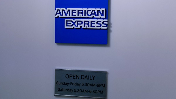 American Express logo and operating hours