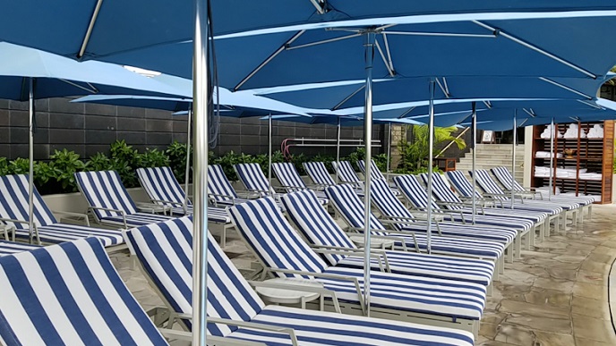 Lounge chairs with large umbrella