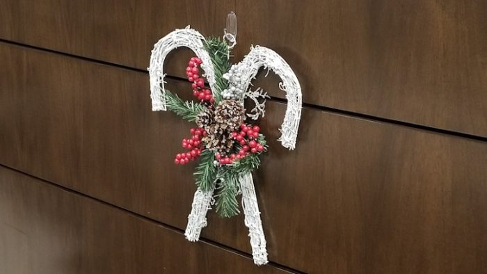 A Christmas decoration hanging on the receptionist counter 
