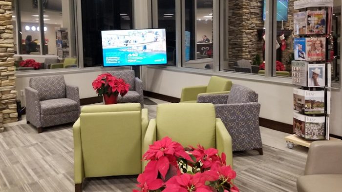 Sofa with Christmas trees and magazine racks