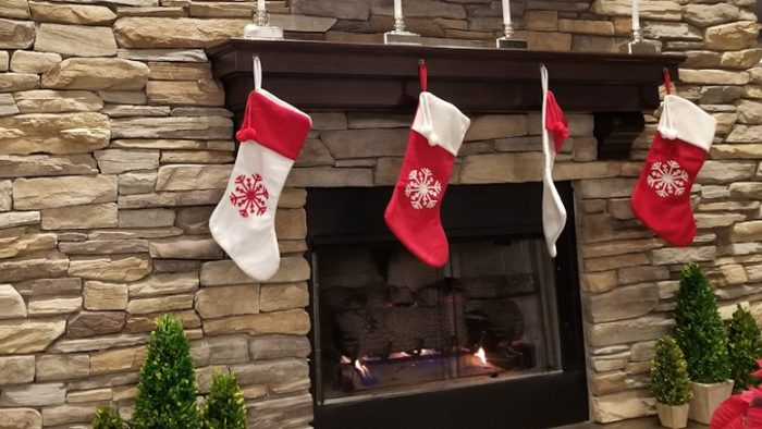 Fireplace with stockings at Signature Flight Support White Plains