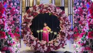 Perjalanan Mewah Lifestyle ~ Evelyn in a pink gown framed by an exquisite floral ring at a birthday celebration