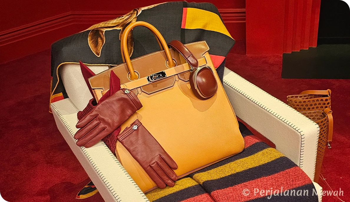 Close-up of Hermès Birkin bag and accessories on an armchair inside the Head Groom’s Office