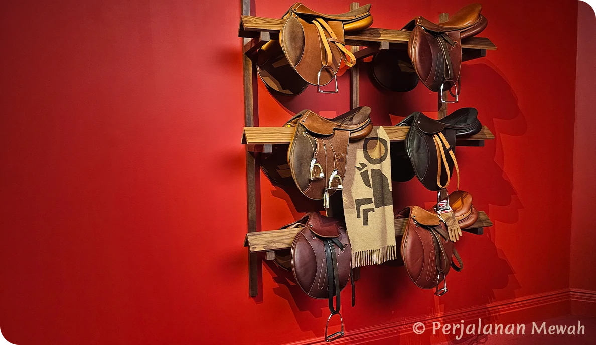 Hermès Mystery The Head Grooms Office saddles on red wall